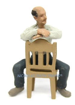 MAN SITTING BACKWARD/CHAIR