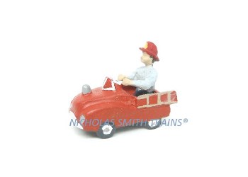 BOY RIDING TOY FIRETRUCK