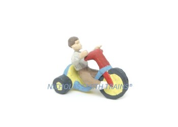 BOY RIDING BIGWHEEL