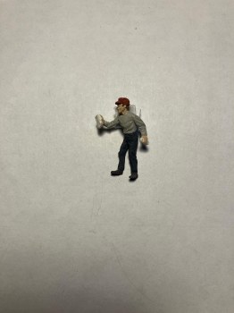 MAN WITH RAG WIPING