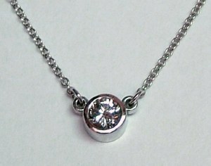 Diamond pendant 0,47 carat round bezel set design model 144-61134-47