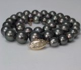 Black Tahitian pearl strand 9-13mm 14kt yellow gold