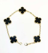 Five motif 18kt yellow gold bracelet black onyx clover model 114-CH709