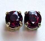 Ruby stud earrings .64cttw 14kt white gold