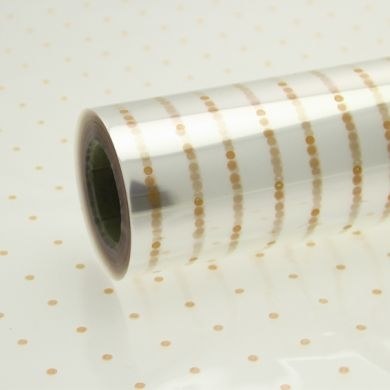 Picture of Cellophane florist wrap gold dots 80cm x 100m