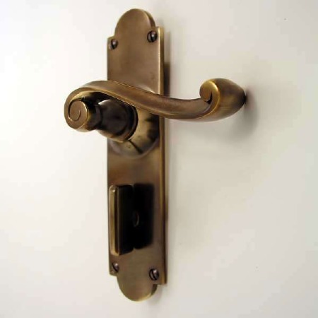 Aston Victorian Scroll Bathroom Door Handles Antique Brass Unlacquered