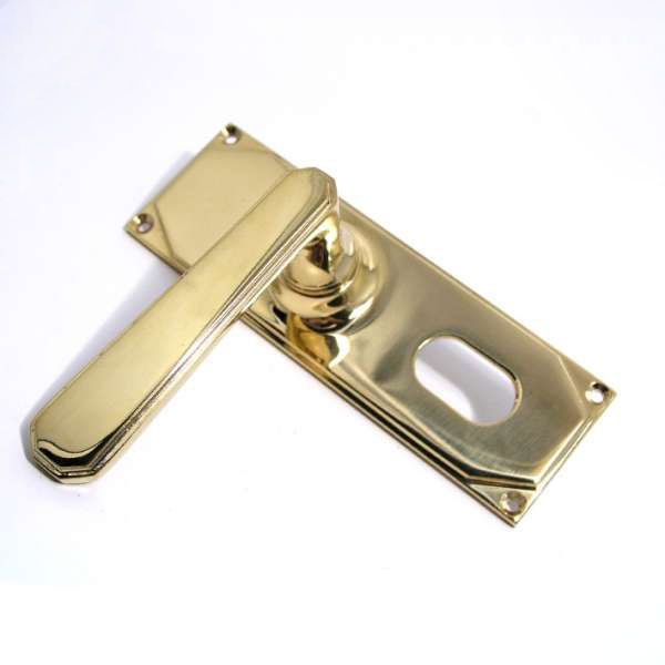 Aston Door Handles Art Deco Lock Plate Oval Profile Pol Brass Unlacquered Broughtons Lighting 6306