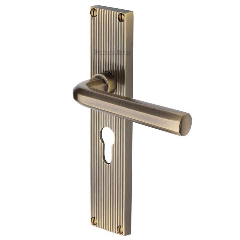 Heritage Octave Reeded Euro Lock Door Handles Antique Brass Lacquered Broughtons Lighting 8287