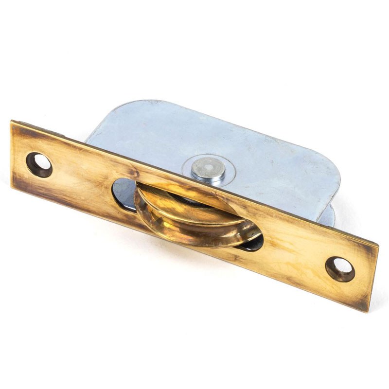 From The Anvil Sash Pulley Aged Brass - Broughtons Lighting & Ironmongery