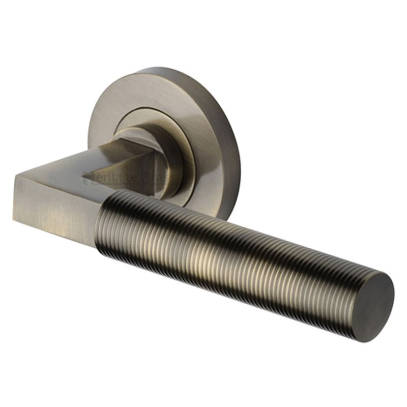 Signac Satin Brass Lever Door Handle on a Round Rose - by Heritage