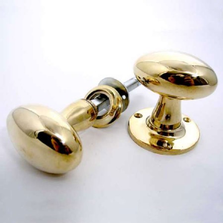 Aston Oval Rim Door Knobs 59mm Polished Brass Unlacquered