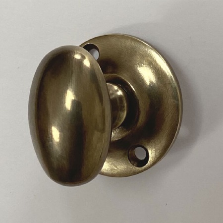 Aston Oval Thumb Turn Only Antique Brass Unlacquered