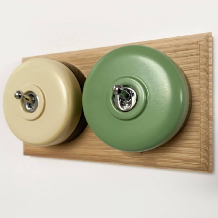 Round Dolly Light Switch 2 Gang Mix and Match on Oak Pattress with Black Mounts