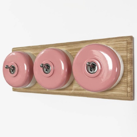 Round Dolly Light Switch 3 Gang Pink on Oak Pattress with White Mount
