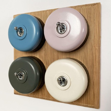 Round Dolly Light Switch 4 Gang Mix and Match on Oak Pattress with Black Mounts