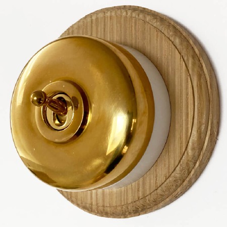Round Dolly Light Switch 1 Gang Polished Brass White Base