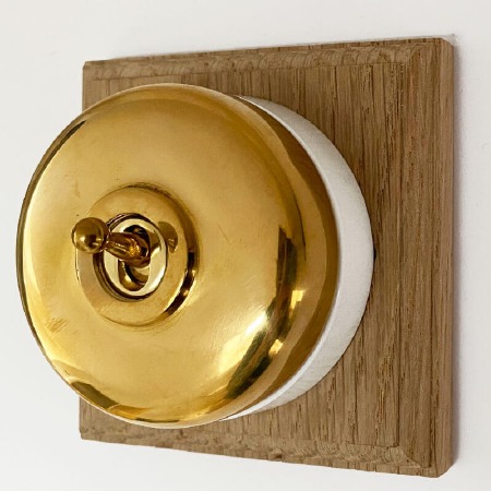 Round Dolly Light Switch 1 Gang Polished Brass White Base