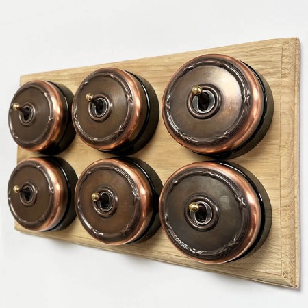 Reed and Ribbon Dome Dolly Light Switch 6 Gang Renovated Copper