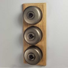 Round Dolly Light Switch 3 Gang on Oak Base Antique Nickel Black