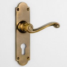 Aston Scroll Door Handle Medium Euro Plate Antique Brass Unlacquered