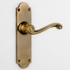 Aston Scroll Door Handle Medium Latch Plate Antique Brass Unlacquered