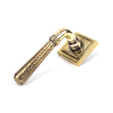 From The Anvil Newbury Lever Door Handles Hammered Square Aged Brass Unsprung