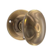 Aston Raised Oval Door Knobs 60mm Antique Brass Unlacquered