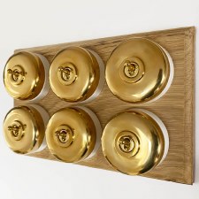 Round Dolly Light Switch on Oak Base 6 Gang Polished Brass
