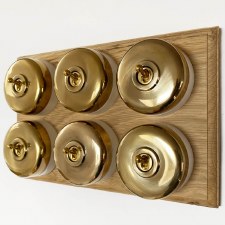 Round Dolly Light Switch on Oak Base 6 Gang Renovated Brass