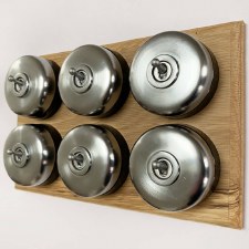 Round Dolly Light Switch on Oak Base 6 Gang Satin Chrome