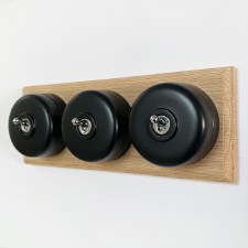 Round Dolly Light Switch 3 Gang Black on Oak Pattress with Black Mount