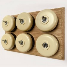 Round Dolly Light Switch 6 Gang Stone on Oak Pattress with Black Mounts