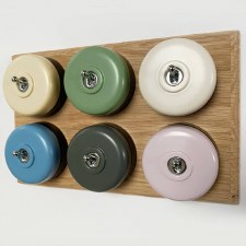 Round Dolly Light Switch 6 Gang Mix and Match on Oak Pattress with Black Mounts