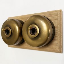 Round Dolly Light Switch on Oak Base Antique Satin Brass 2 Gang