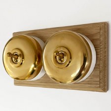 Round Dolly Light Switch on Oak Base Polished Brass 2 Gang