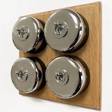 Round Dolly Light Switch 4 Gang on Oak Base Chrome Black