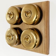 Round Dolly Light Switch 4 Gang on Oak Base Renovated Brass Black