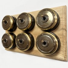 Reed and Ribbon Dome Dolly Light Switch 6 Gang Renovated Brass