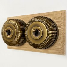 Reeded Round Dolly Light Switch on Oak Base Antique Satin Brass 2 Gang