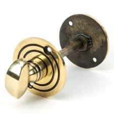 From The Anvil Round Bathroom Thumb Turn & Release Aged Brass