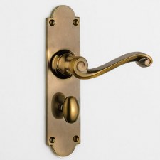 Aston Scroll Bathroom Handles Oval Turn Antique Brass Unlacquered