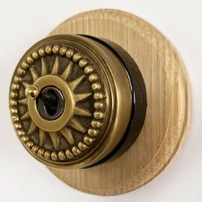 Star Round Dolly Light Switch Antique Satin Brass