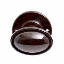 Additional picture of Bakelite Stepped Oval Door Knobs on Round Rose Walnut
