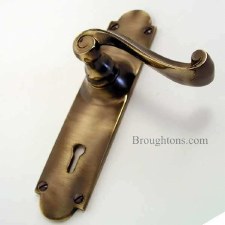 Additional picture of Aston Victorian Scroll Door Handles Lock Plate Antique Brass Unlacquered