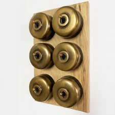 Additional picture of Round Dolly Light Switch on Oak Base 6 Gang Antique Satin Brass