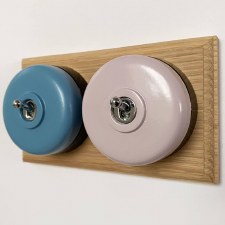 Additional picture of Round Dolly Light Switch 2 Gang Mix and Match on Oak Pattress with Black Mounts
