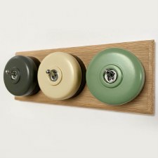 Additional picture of Round Dolly Light Switch 3 Gang Mix and Match on Oak Pattress with Black Mounts