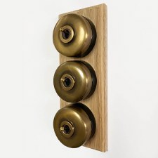 Additional picture of Round Dolly Light Switch 3 Gang on Oak Base Antique Satin Brass Black