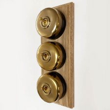 Additional picture of Round Dolly Light Switch 3 Gang on Oak Base Renovated Brass Black