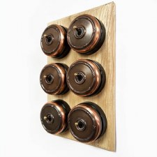 Additional picture of Reed and Ribbon Dome Dolly Light Switch 6 Gang Renovated Copper